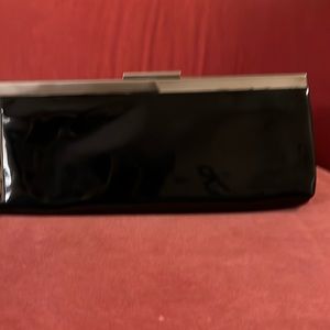 Calvin Klein black patent clutch